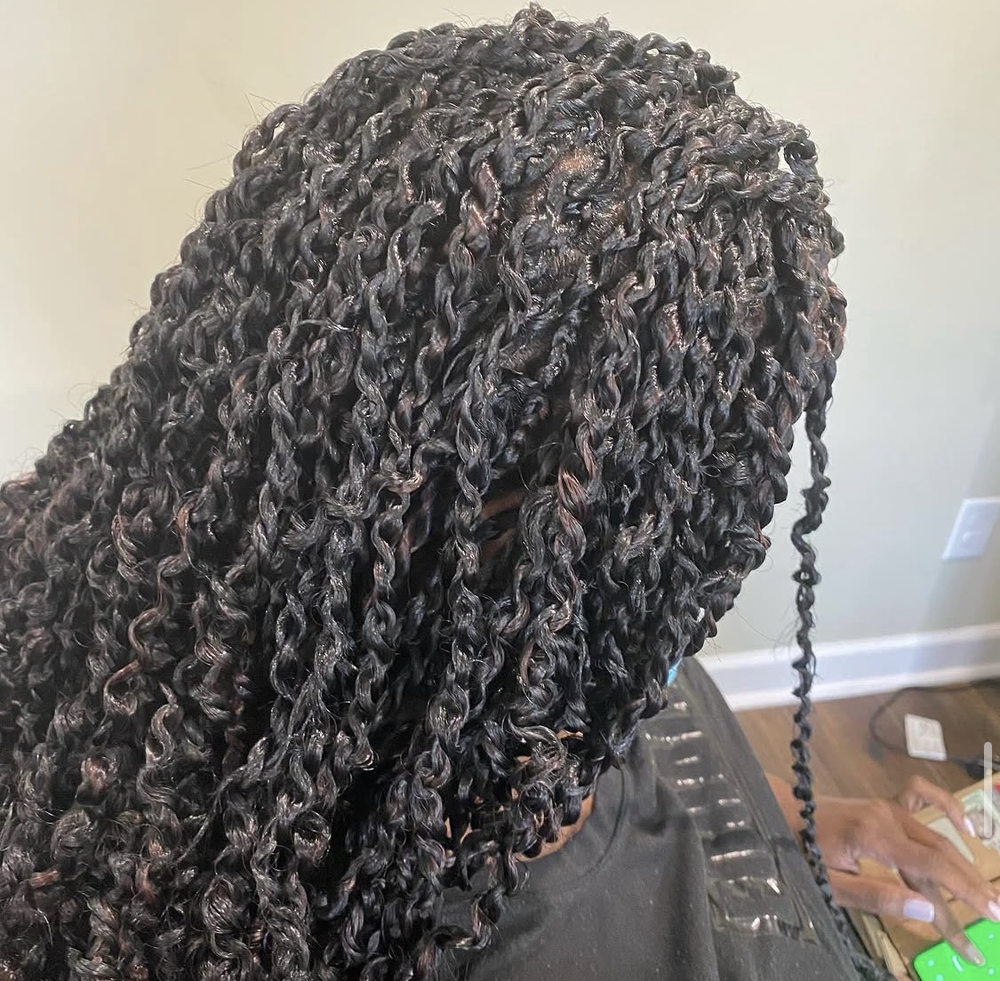 Close-up of glossy passion twists installed by Amajoris
