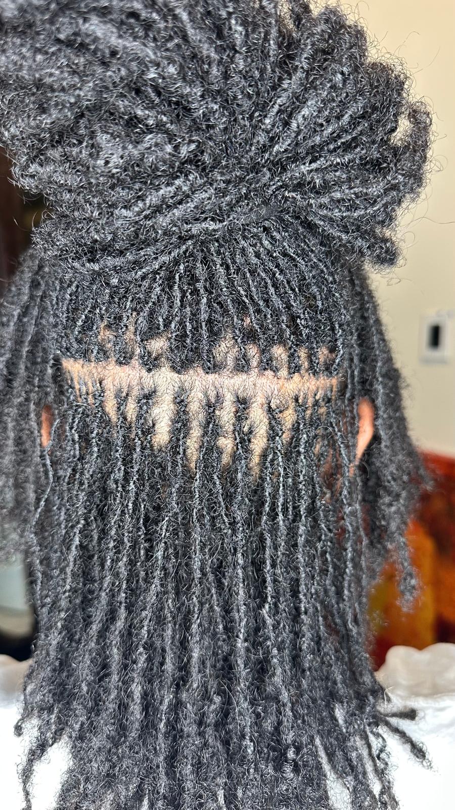 Close-up of neat parting rows on mini twists by Amajoris