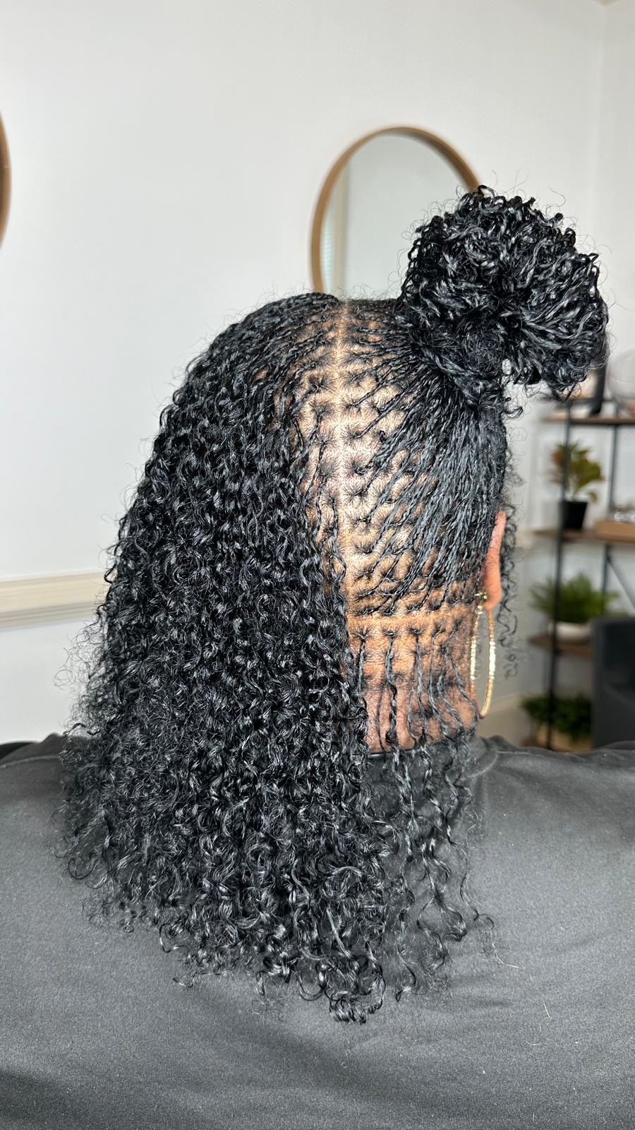 Boho braids with curly ends in a side-parted style by Amajoris